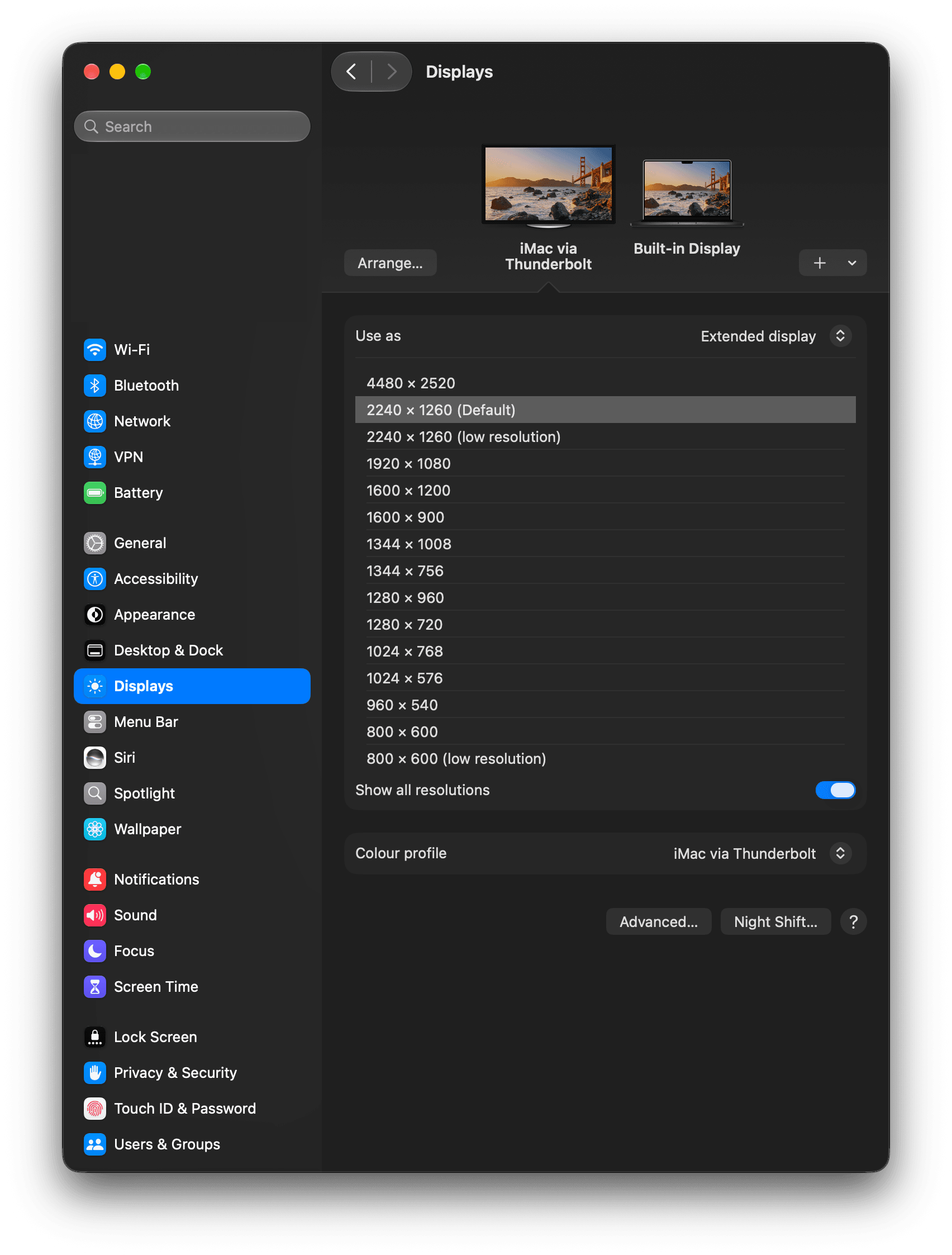 macOS System Settings on the MacBook, Displays pane, showing iMac via Thunderbolt as an extended display set to 2240 x 1260 (Default)